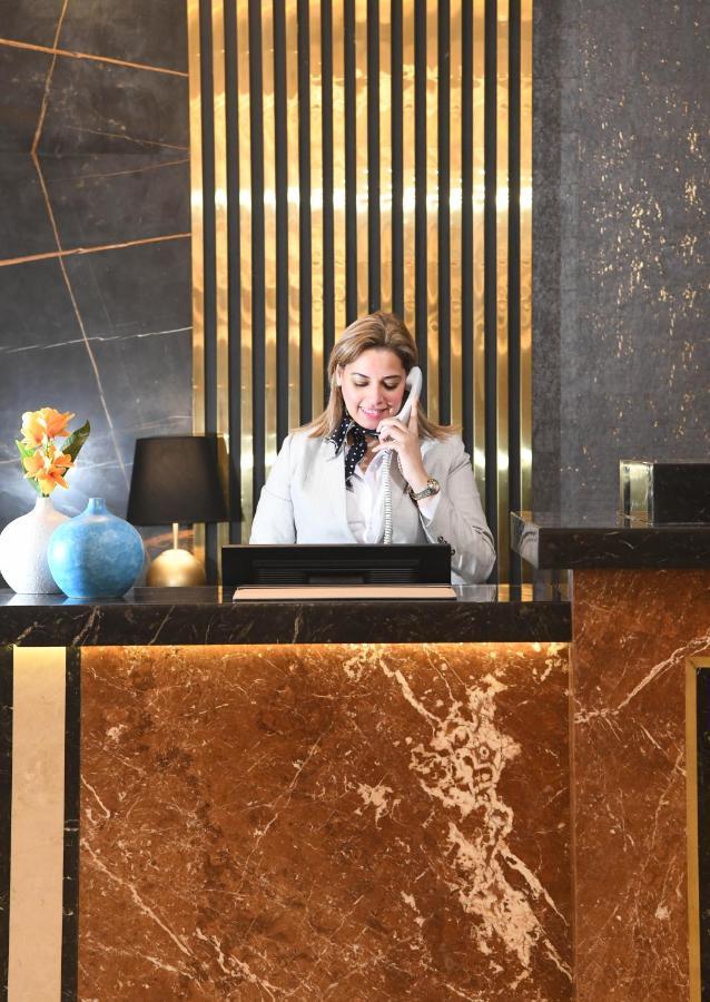 Tolip Gardens Hotel Cairo Exterior photo A hotel receptionist